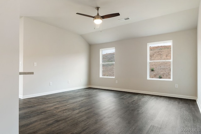 spare room with ceiling fan, dark hardwood / wood-style flooring, and lofted ceiling