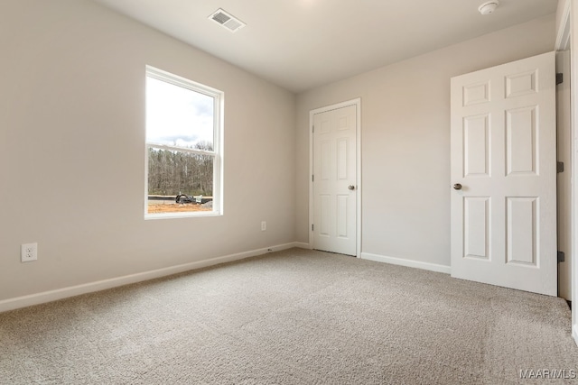 unfurnished bedroom featuring carpet