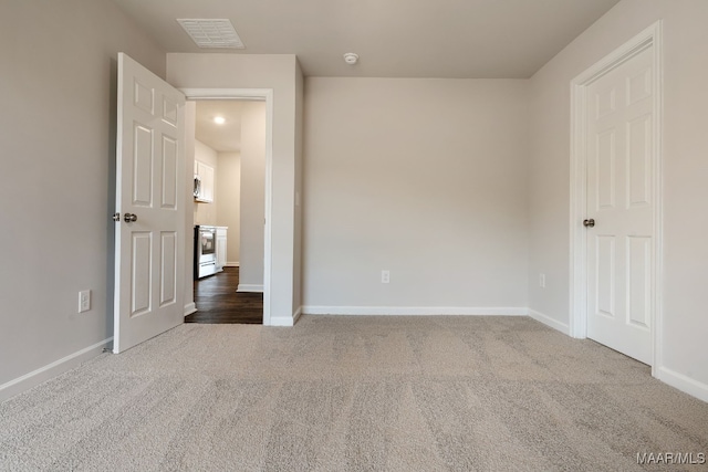 empty room featuring carpet floors