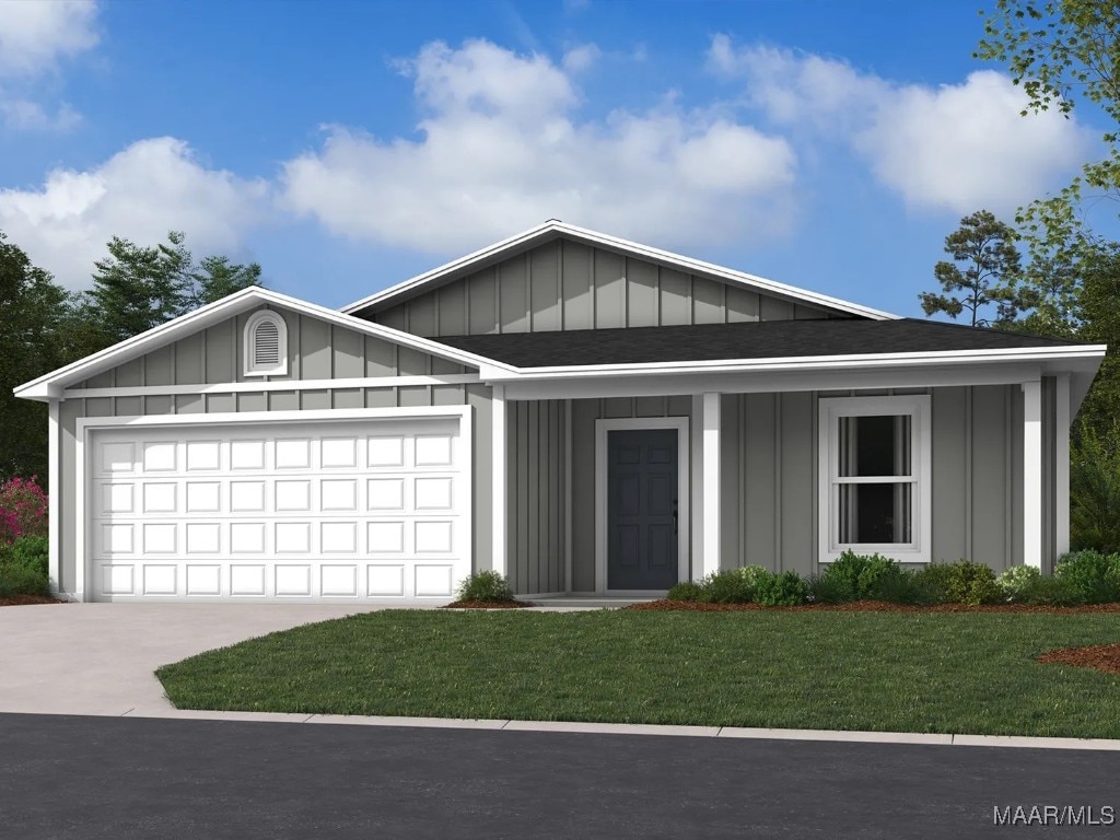 80 Canal Xing, Wetumpka, AL 36092 - view of front of house with board and batten siding, driveway, a front yard, a shingled roof, and a garage