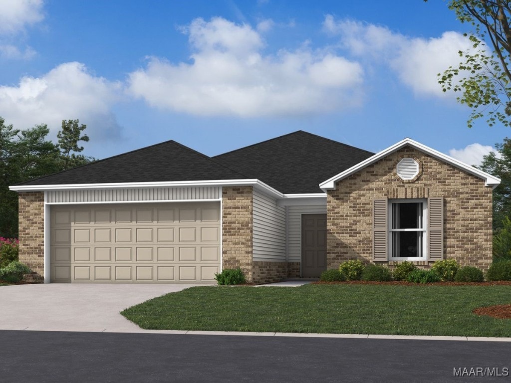 view of front of house with a front lawn and a garage