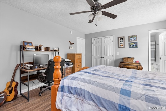 bedroom with a textured ceiling, ceiling fan, wood finished floors, a closet, and ensuite bath