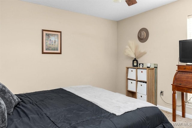 bedroom with carpet and baseboards