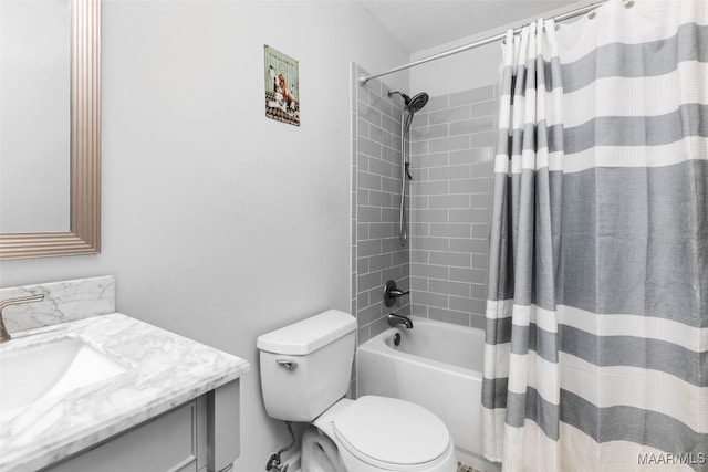 full bath featuring shower / bath combo, vanity, and toilet