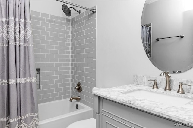 full bathroom featuring vanity, toilet, and shower / tub combo