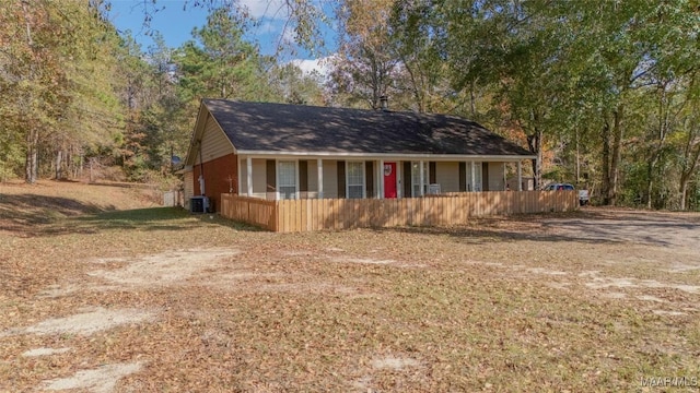 view of front of property featuring a porch and cooling unit