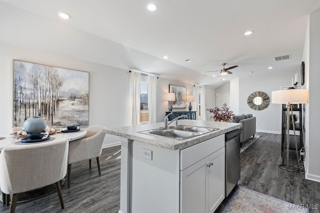 kitchen featuring ceiling fan, a kitchen island with sink, sink, dishwasher, and white cabinets