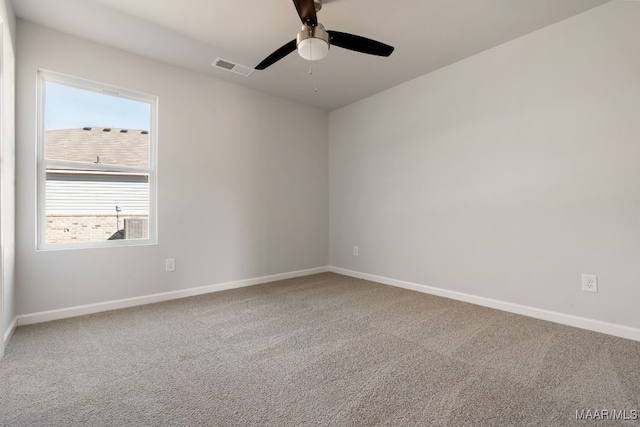 unfurnished room with ceiling fan and carpet flooring