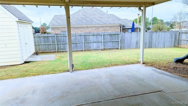 view of patio featuring a storage shed