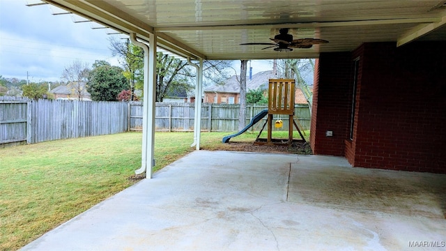 view of patio / terrace featuring a playground and ceiling fan