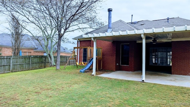 view of yard featuring ceiling fan and a patio area