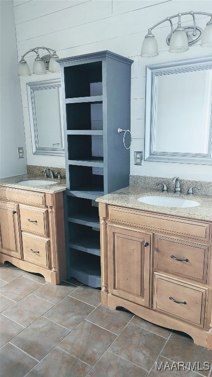 bathroom featuring vanity and wooden walls