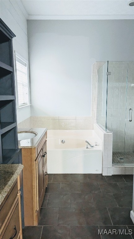 bathroom featuring vanity, independent shower and bath, and ornamental molding