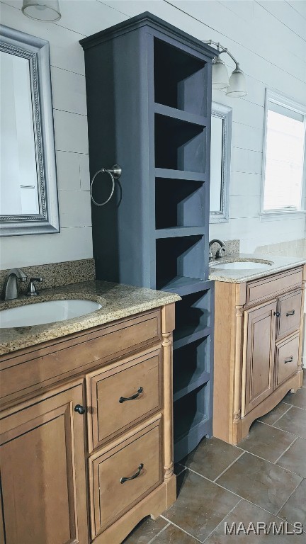 bathroom featuring tile patterned flooring and vanity