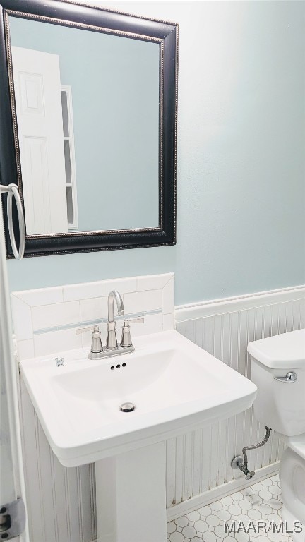 bathroom with toilet and sink