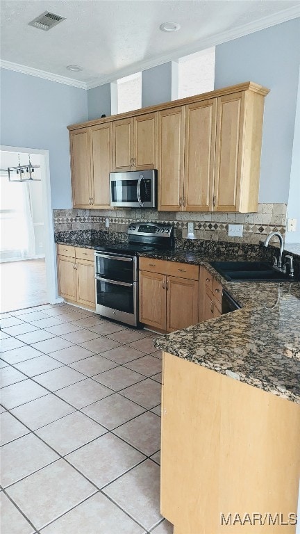 kitchen featuring decorative backsplash, stainless steel appliances, ornamental molding, and sink