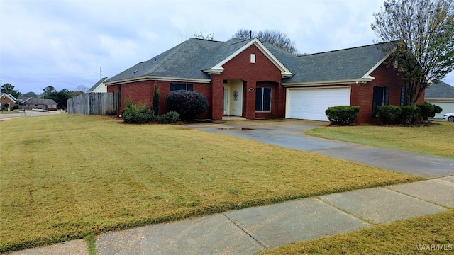 view of front facade with a front yard and a garage