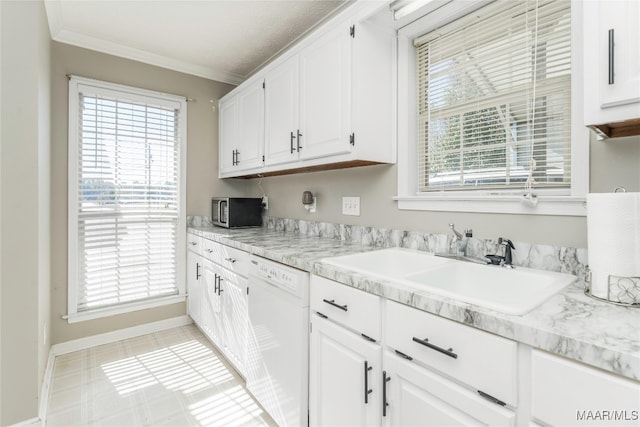 kitchen featuring white dishwasher, white cabinetry, and a wealth of natural light