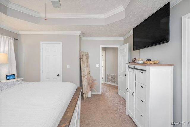 carpeted bedroom with ceiling fan, ornamental molding, and a textured ceiling