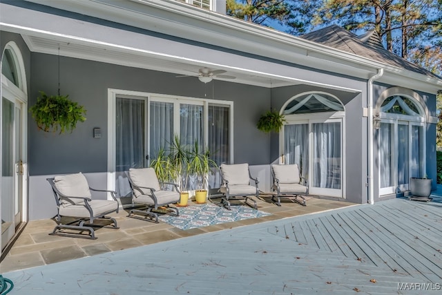 exterior space featuring ceiling fan