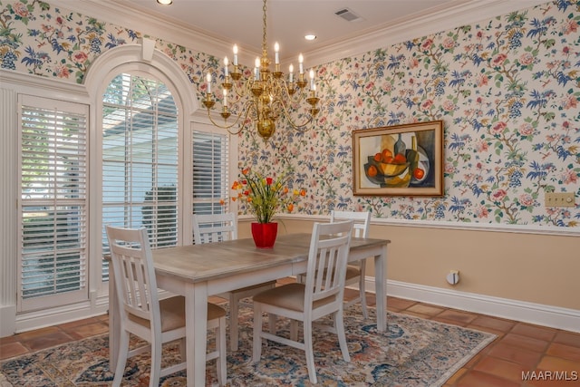 dining area with crown molding and a chandelier