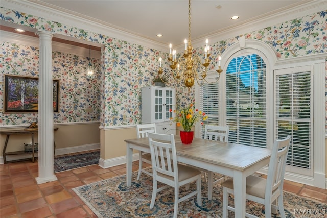 dining room with ornate columns, crown molding, and an inviting chandelier