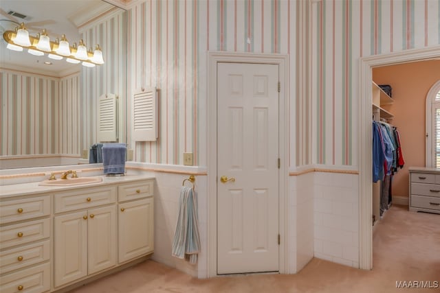 bathroom featuring vanity and crown molding