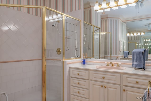 bathroom featuring vanity, an enclosed shower, and crown molding