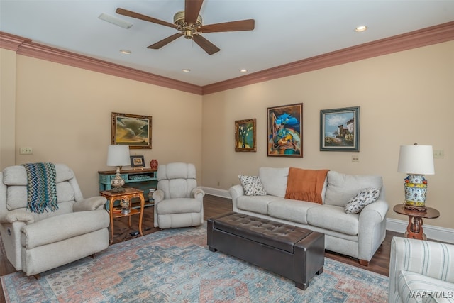 living room featuring hardwood / wood-style floors, ceiling fan, and crown molding