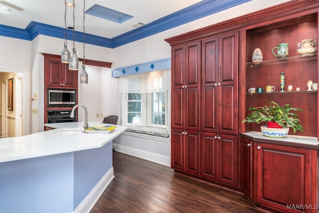 kitchen with dark hardwood / wood-style flooring, ornamental molding, decorative light fixtures, black oven, and stainless steel microwave