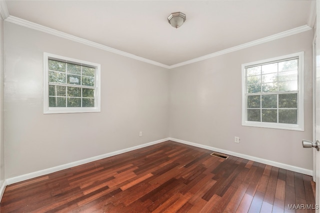 unfurnished room featuring dark hardwood / wood-style flooring and ornamental molding