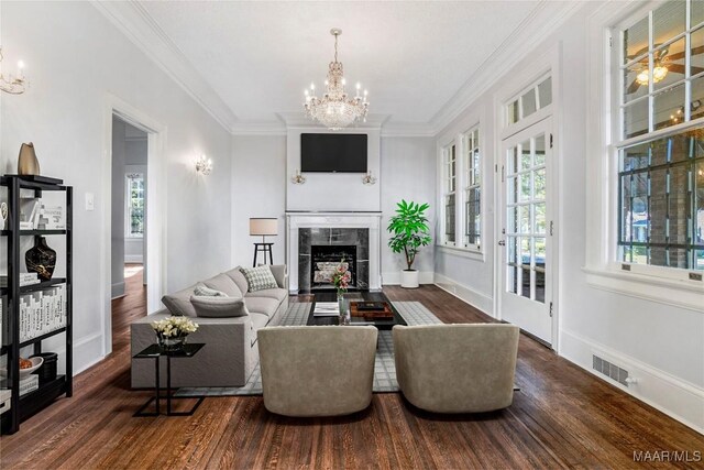 1427 S Court St, Montgomery, AL 36104 - living area with a chandelier, wood finished floors, and ornamental molding