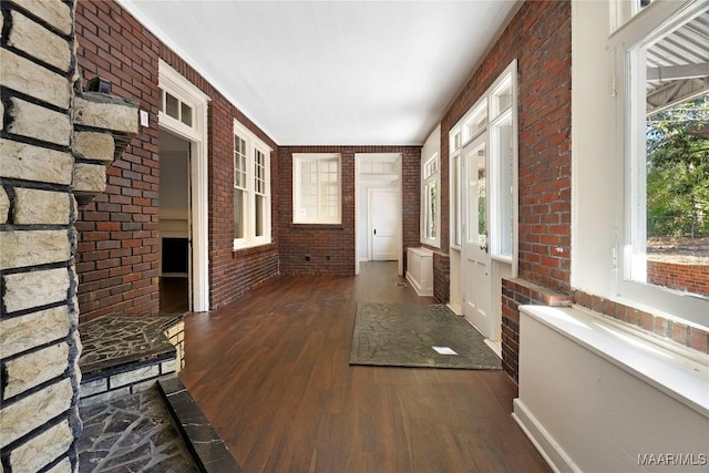 1427 S Court St, Montgomery, AL 36104 - hall featuring brick wall and wood finished floors