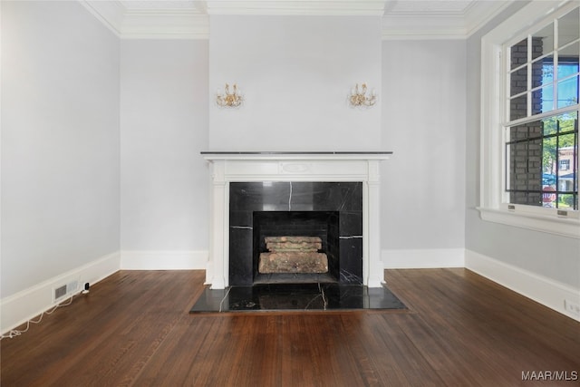 room details with a fireplace, wood-type flooring, and ornamental molding