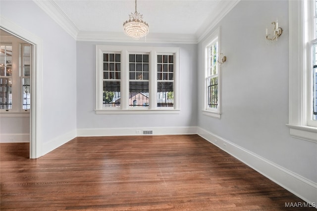 unfurnished dining area with a notable chandelier, dark hardwood / wood-style floors, and ornamental molding