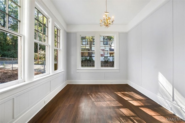 1427 S Court St, Montgomery, AL 36104 - unfurnished dining area featuring a chandelier, healthy amount of natural light, and dark wood-style floors