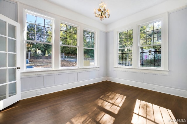 unfurnished sunroom with an inviting chandelier