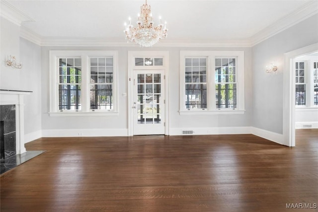 1427 S Court St, Montgomery, AL 36104 - unfurnished living room featuring wood finished floors, a chandelier, ornamental molding, a premium fireplace, and baseboards