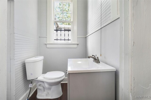 1427 S Court St, Montgomery, AL 36104 - bathroom featuring vanity, toilet, and baseboards