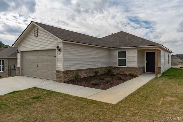 ranch-style home with a garage and a front yard