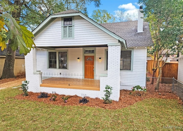 bungalow featuring a porch and a front yard