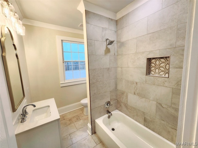 full bathroom featuring vanity, ornamental molding, tiled shower / bath combo, and toilet