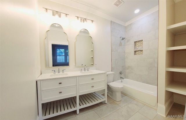 full bathroom with vanity, toilet, built in features, and tiled shower / bath