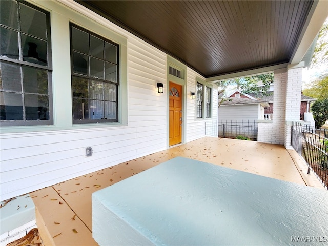 view of patio featuring a porch