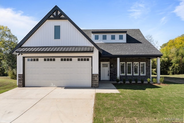 view of front of house with a garage and a front lawn