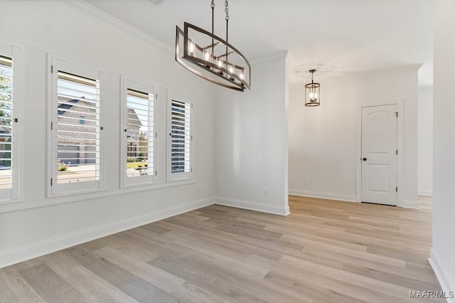 2524 Crenshaw Close Ct S, Montgomery, AL 36106 - unfurnished dining area with a chandelier, crown molding, light wood finished floors, and baseboards