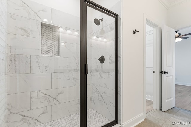 bathroom with crown molding, ceiling fan, a shower with shower door, and hardwood / wood-style flooring