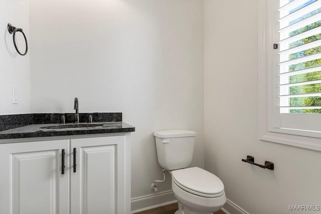 2524 Crenshaw Close Ct S, Montgomery, AL 36106 - half bath featuring baseboards, toilet, vanity, and wood finished floors