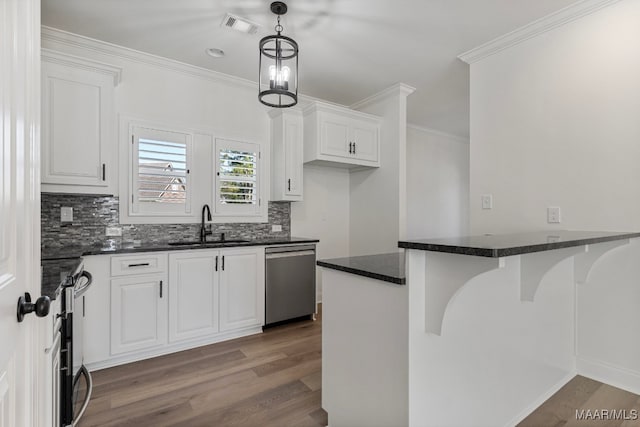 kitchen featuring white cabinets, pendant lighting, kitchen peninsula, and stainless steel dishwasher