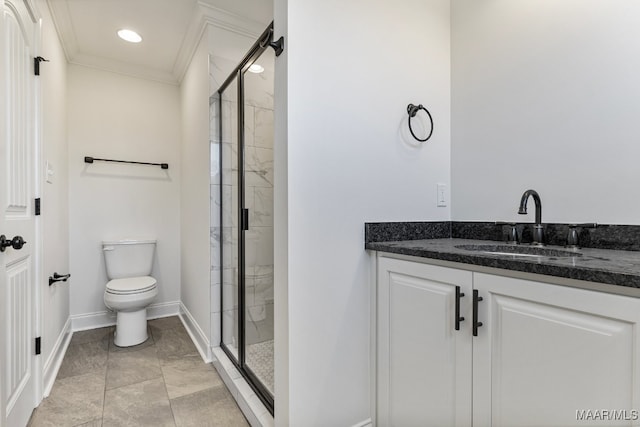 bathroom featuring crown molding, a shower with door, vanity, and toilet